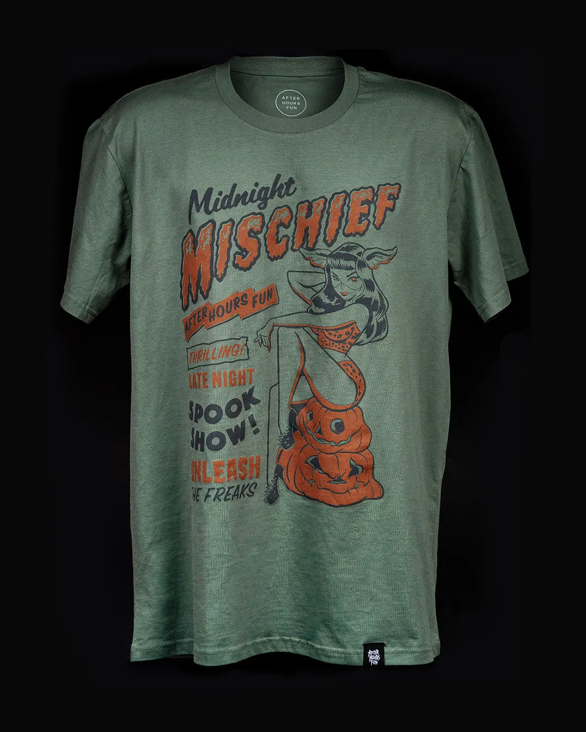 Front of the After Hours Fun Midnight Mischief t-shirt in an olive green heather fabric, featuring a vintage orange and black graphic of a Halloween pinup girl sitting on a jack-o'-lantern.