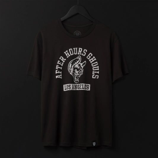Cream collegiate t-shirt with a black circular wolf mascot graphic and 'After Hours Ghouls Los Angeles' typography.